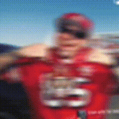 a blurry picture of a football player wearing a red jersey with the number 28 on it
