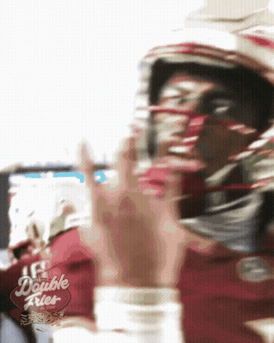 A Blurry Picture Of A Football Player With A Double Fries Sign In The Corner GIF