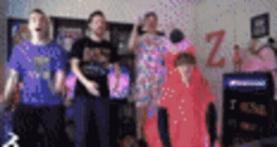 A Blurry Picture Of A Group Of People Standing In Front Of A Sign That Says Z. GIF