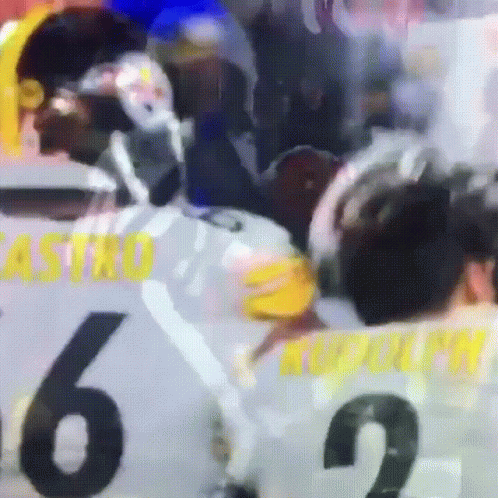 A Blurry Picture Of A Hockey Game With Castro 6 And Rudolph 2 GIF