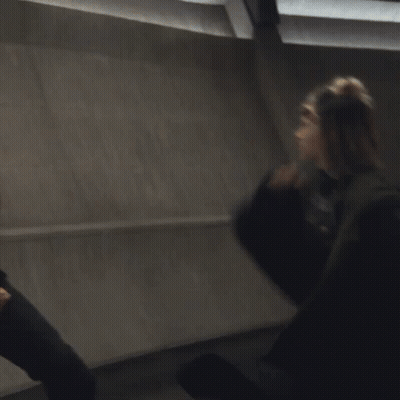 A Blurry Picture Of A Man And A Woman Fighting GIF