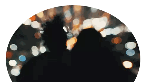 A Blurry Picture Of A Man And A Woman In A Dark Room Sticker