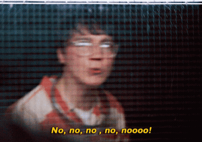 A Blurry Picture Of A Man Behind A Fence With The Words No No No No Nooo GIF