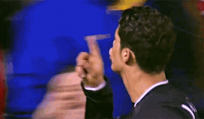 A Blurry Picture Of A Man Giving A Middle Finger To Another Man GIF