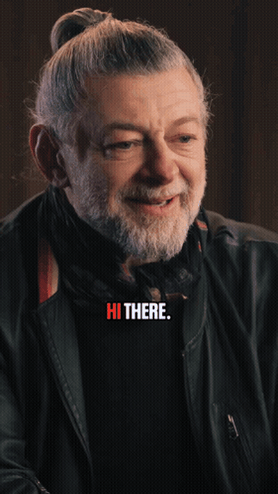 A Blurry Picture Of A Man Holding A Cell Phone With The Words " It 'S John Pork " Above Him GIF