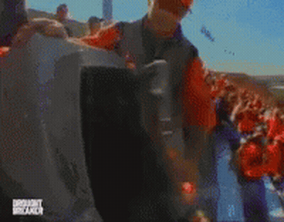A Blurry Picture Of A Man Holding A Sign That Says ' Donald Trump Brunch ' GIF