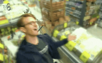A Blurry Picture Of A Man In A Store With Tv8 On The Bottom GIF
