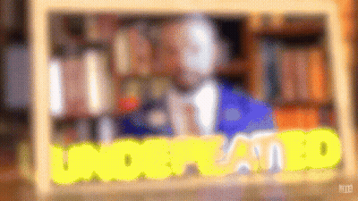 A Blurry Picture Of A Man In A Suit And Tie With The Words Understood In Yellow Letters . GIF