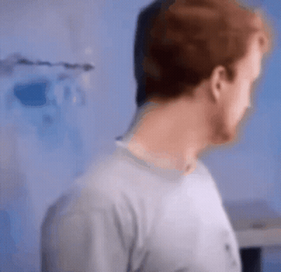 A Blurry Picture Of A Man 'S Face And Neck GIF