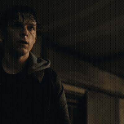 A Blurry Picture Of A Man 'S Face With A Blue Background GIF