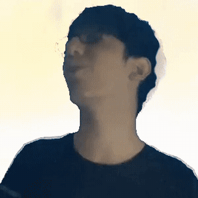 A Blurry Picture Of A Man 'S Face With A Yellow Background GIF