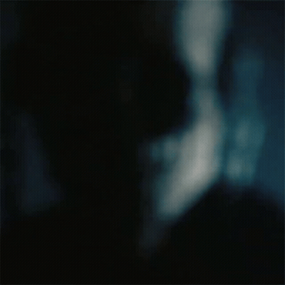 A Blurry Picture Of A Man 'S Face With Sunglasses On . GIF