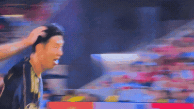 A Blurry Picture Of A Man 'S Head With A Crowd In The Background Behind Him GIF