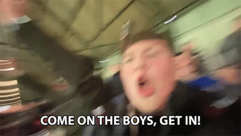 A Blurry Picture Of A Man Saying Come On The Boys Get In ! GIF