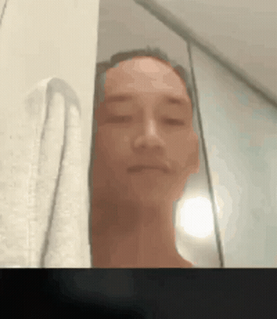 A Blurry Picture Of A Man Taking A Selfie GIF