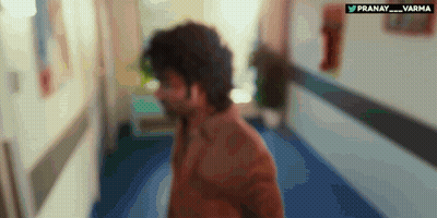 A Blurry Picture Of A Man Walking Down A Hallway With The Words Pranay Varma Written On The Bottom GIF