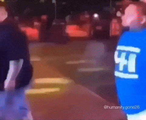 A Blurry Picture Of A Man Wearing A Blue Shirt With The Number 41 On It GIF
