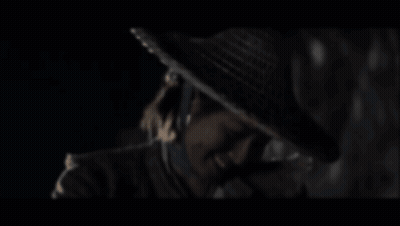 A Blurry Picture Of A Man Wearing A Hat GIF