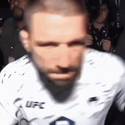 A Blurry Picture Of A Man Wearing A Ufc Jersey GIF