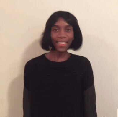 A Blurry Picture Of A Man Wearing A Wig And A Black Sweater . GIF