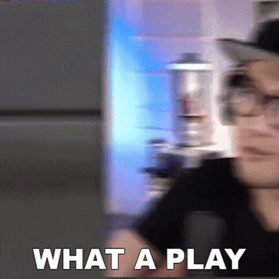 A Blurry Picture Of A Man With Glasses And The Words What A Play In White Letters GIF