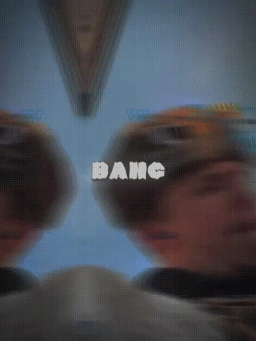 A Blurry Picture Of A Man With The Word Bang Written On It GIF