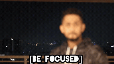 A Blurry Picture Of A Man With The Words Be Focused Written Above Him GIF