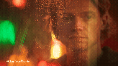 A Blurry Picture Of A Man With The Words #Clayfacemovie Below GIF
