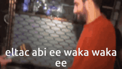 A Blurry Picture Of A Man With The Words Eltac Abi Ee Waka Waka Ee Written On It GIF