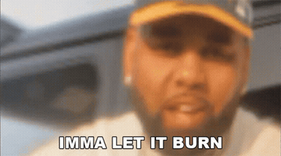 A Blurry Picture Of A Man With The Words Imma Let It Burn Above Him GIF