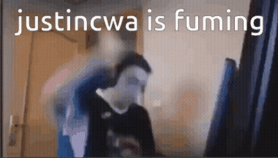 A Blurry Picture Of A Man With The Words Justincwa Is Fuming Written On The Bottom GIF