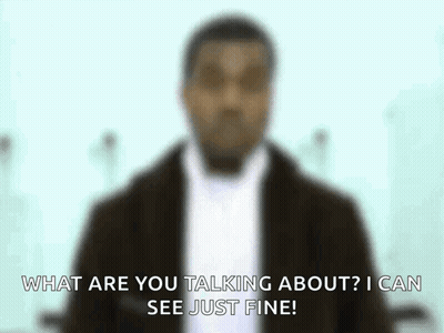 a blurry picture of a man with the words what are you talking about i can see just fine .