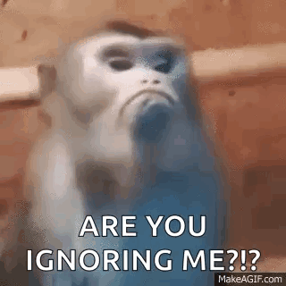 A Blurry Picture Of A Monkey With The Words `` Are You Ignoring Me ? '' Written On It . GIF