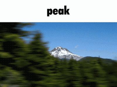 A Blurry Picture Of A Mountain And The Word Peak GIF