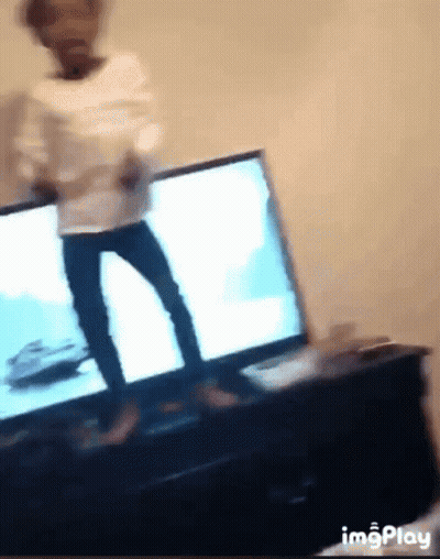 A Blurry Picture Of A Person Dancing In Front Of A Tv GIF