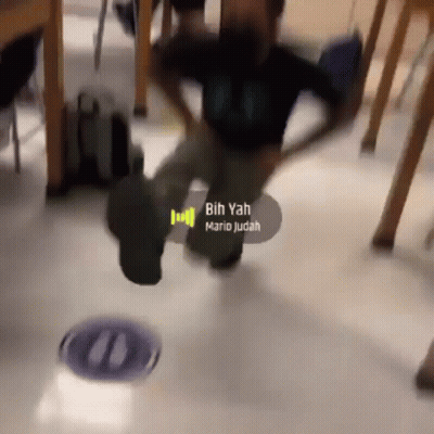 A Blurry Picture Of A Person Dancing With The Words " Bih Yah " On The Bottom GIF