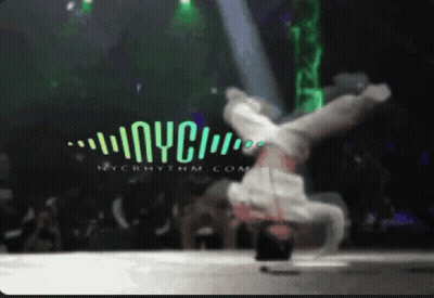 A Blurry Picture Of A Person Doing A Handstand In Front Of A Nyc Logo GIF