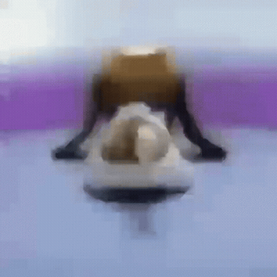 A Blurry Picture Of A Person Doing A Yoga Pose On A Purple Surface . GIF