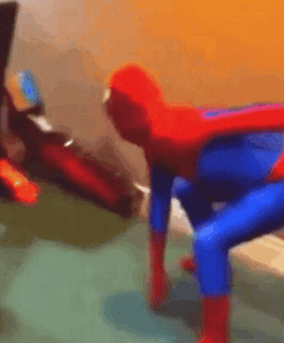 A Blurry Picture Of A Person Dressed As A Spiderman GIF