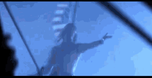 A Blurry Picture Of A Person Flying Through The Air GIF