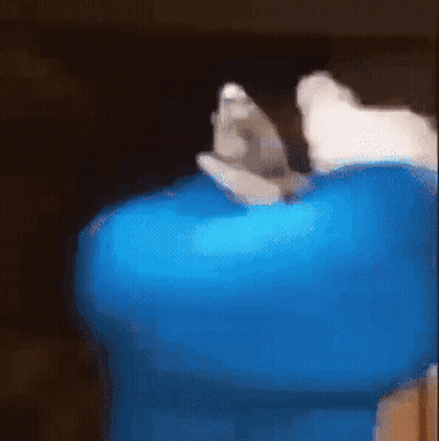 A Blurry Picture Of A Person Holding A Blue Item GIF