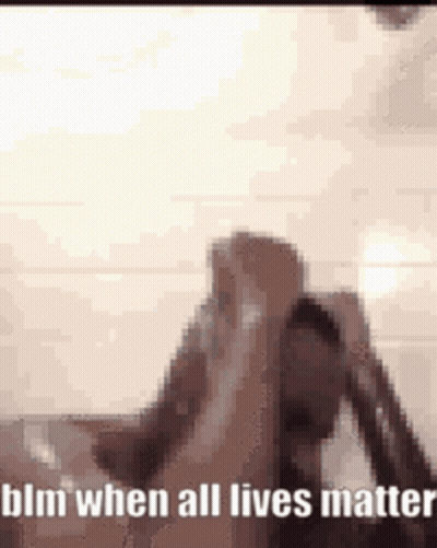 A Blurry Picture Of A Person Holding Their Head And The Words Blm When All Lives Matter . GIF