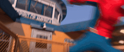 A Blurry Picture Of A Person Jumping In Front Of A Building That Says ' United States Of America ' GIF