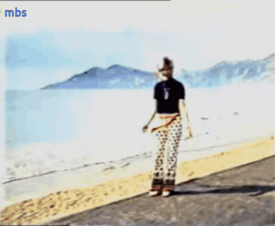 A Blurry Picture Of A Person On A Beach With Mbs Written On The Bottom Right GIF