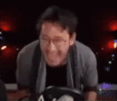 Blurry Person Playing Guitar In Dark Room GIF