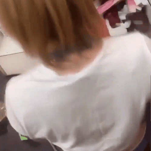 A Blurry Picture Of A Person 'S Back And Neck GIF