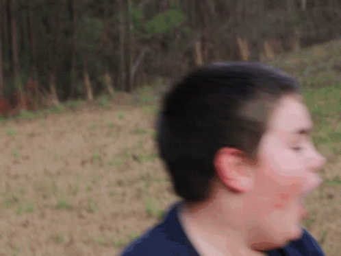 A Blurry Picture Of A Person 'S Face And Head GIF