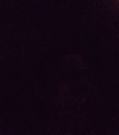 A Blurry Picture Of A Person 'S Face In A Dark Room With A Purple Background . GIF