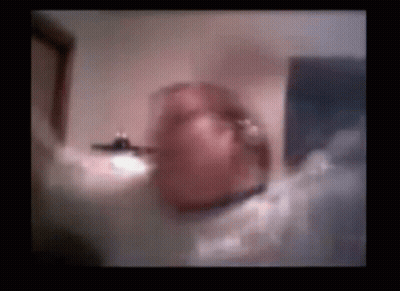 A Blurry Picture Of A Person 'S Face In A Room . GIF