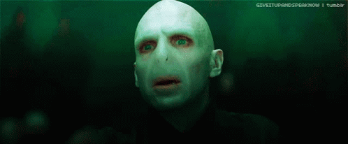 A Blurry Picture Of A Person 'S Face With A Light Behind Them GIF